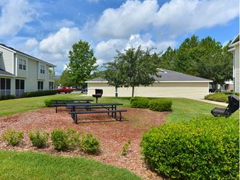 Exterior bbq grill and picnic tables 